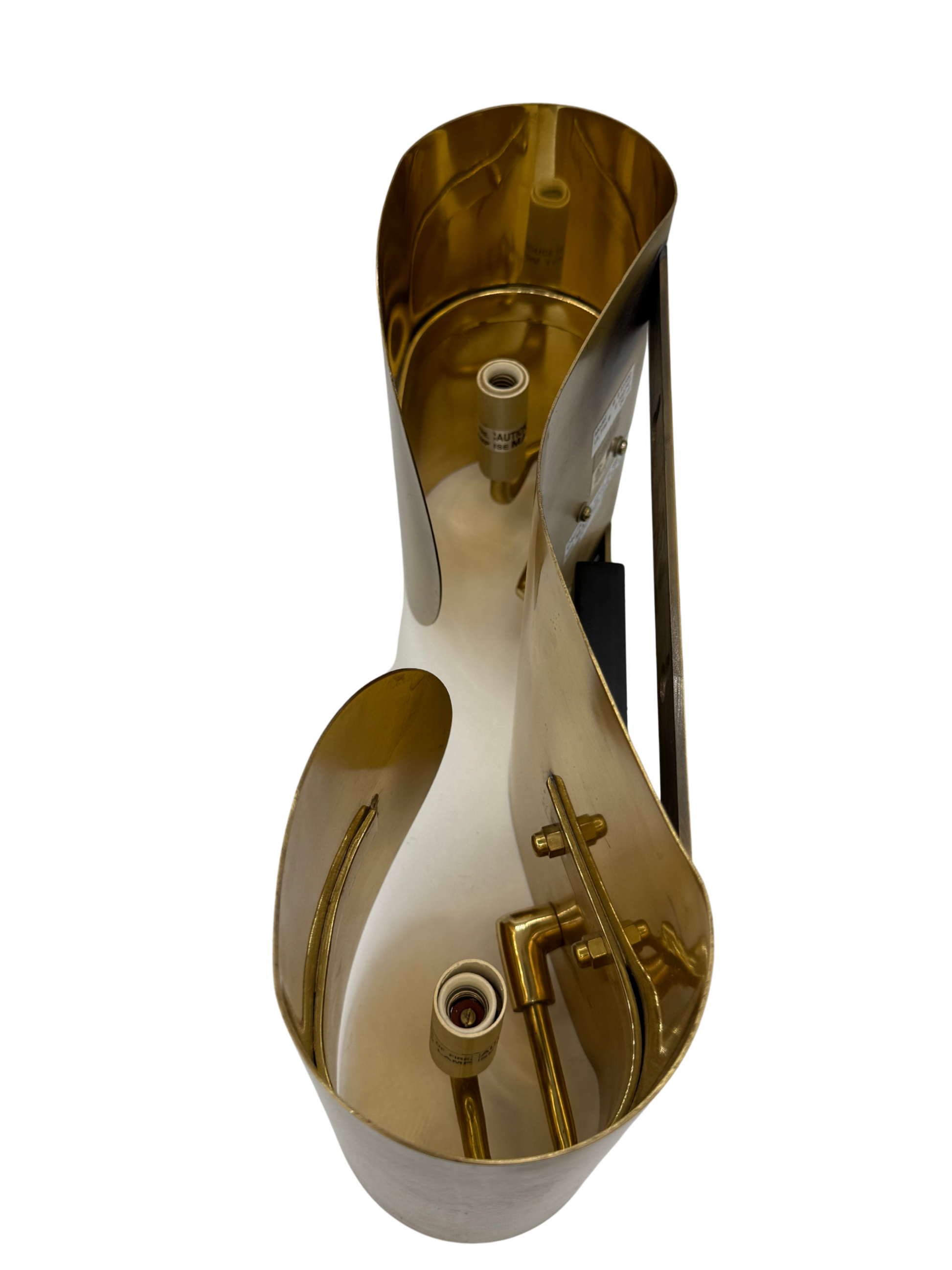interior detail of vintage brass wall sconce showing dual bulb sockets and original mounting structure, Italian postmodern lighting.